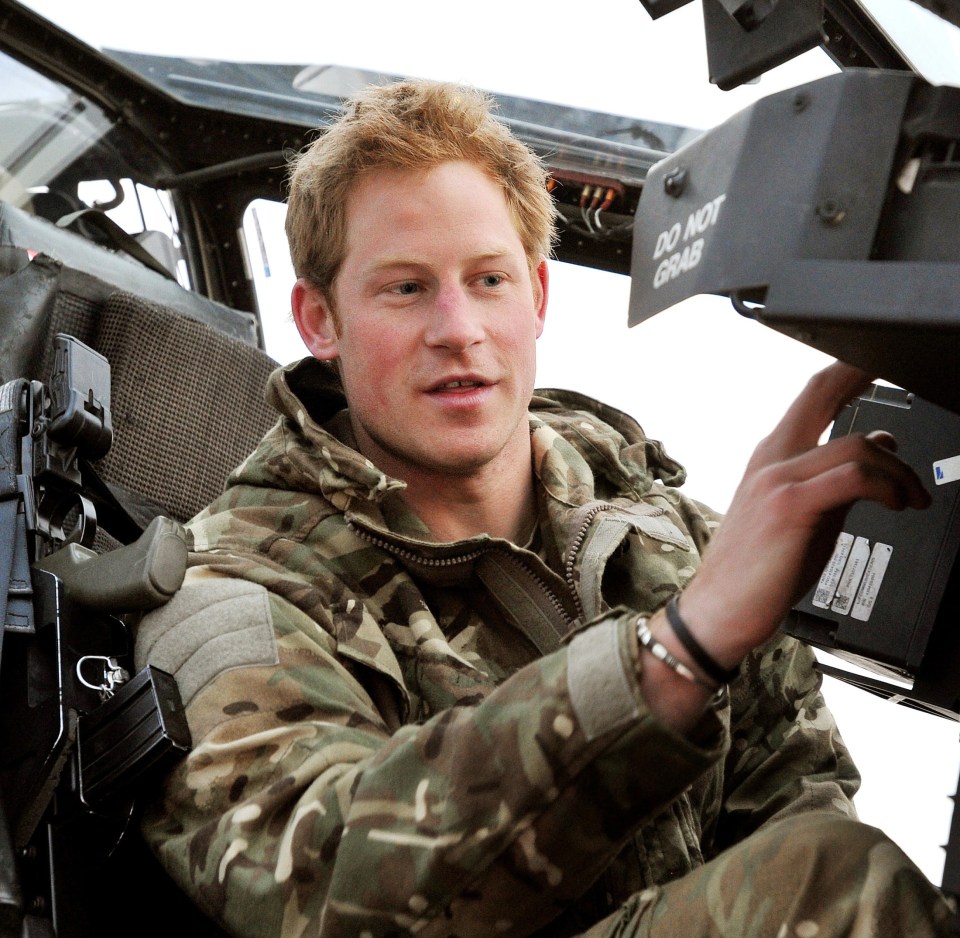 Prince Harry makes his early morning pre-flight checks in his helicopter in Afghanistan
