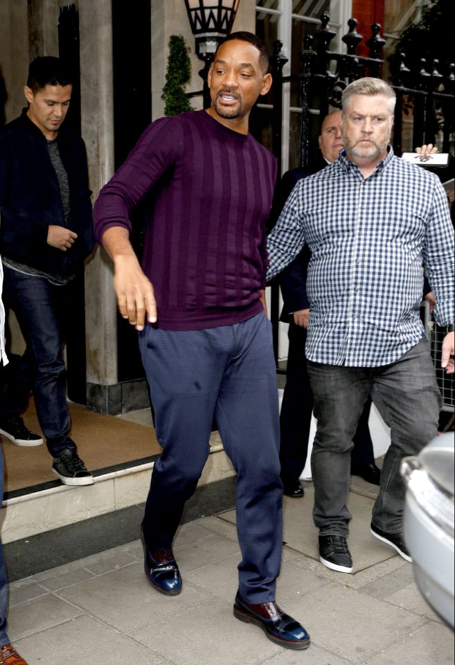 Will Smith looked dapper in his smart trousers and purple jumper
