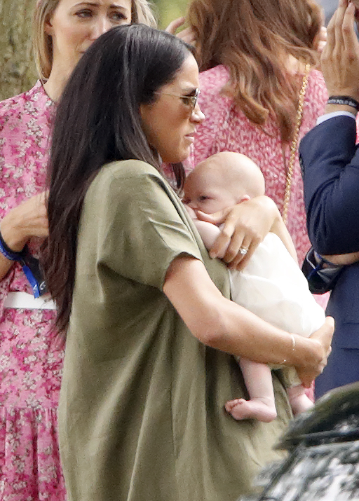 Royal fans caught sight of Archie's face as Meghan held him tightly 