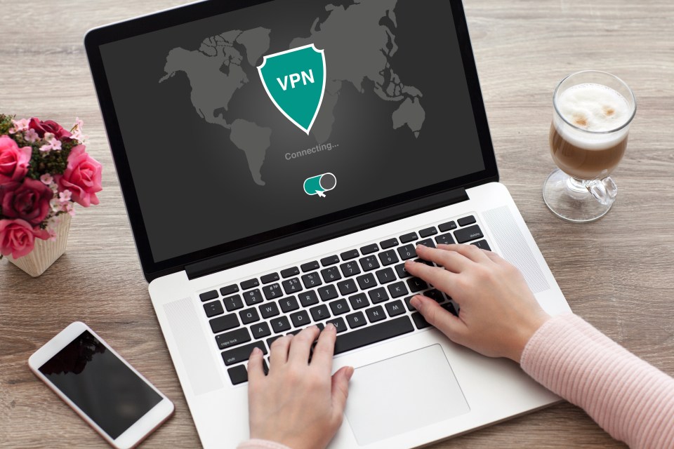 Woman connecting to a VPN on her laptop.