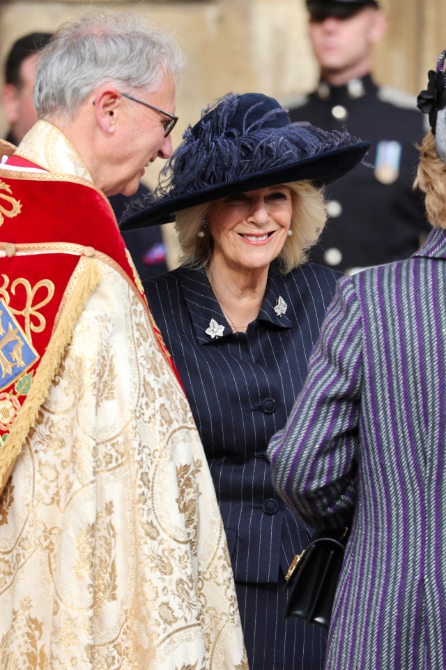 The Queen beamed as she talked to other guests at Windsor