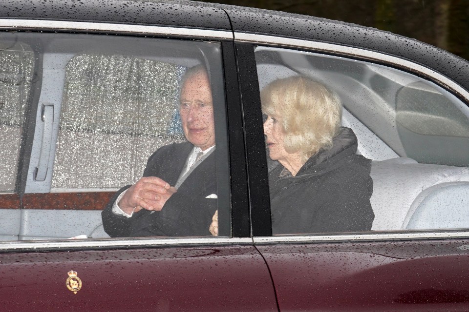 King Charles III and Queen Camilla in a car.