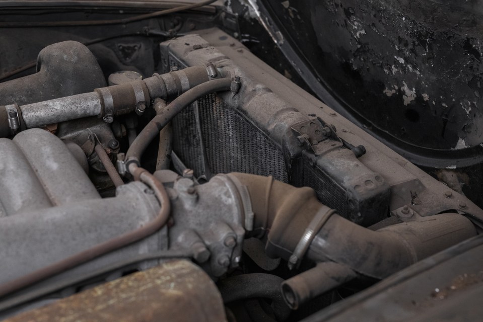 the inside of an old car with a steering wheel