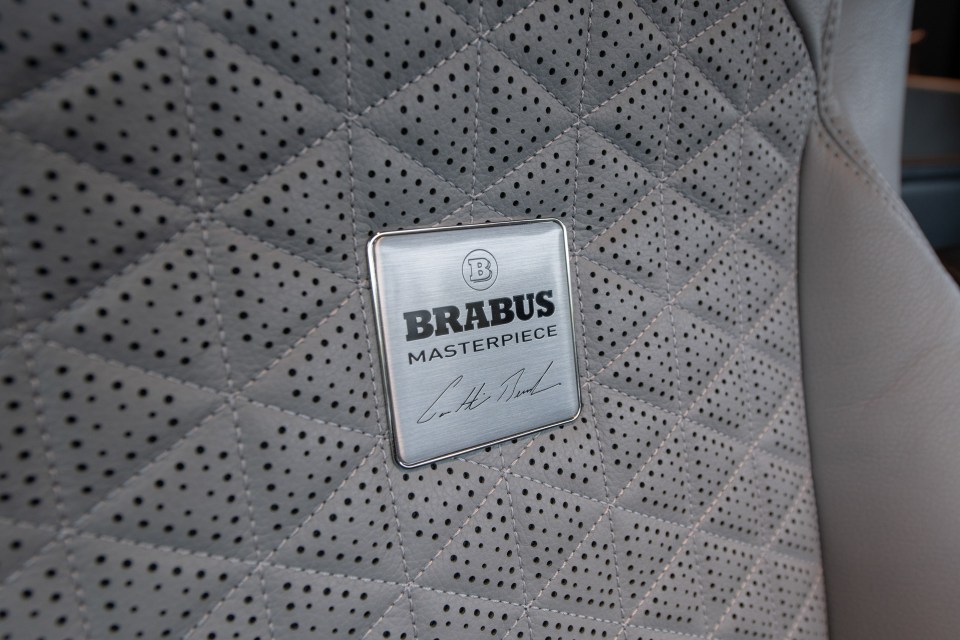 a brabus masterpiece logo is on the back of a car seat