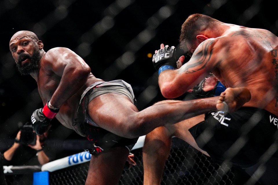 Mixed martial arts fighters Jon Jones and an opponent during a fight.