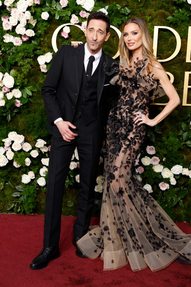 Adrien Brody and girlfriend Georgina Chapman on the red carpet at the Golden Globes in 2025