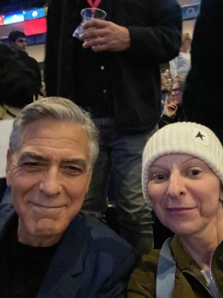 George Clooney and a woman at a Paul McCartney concert.