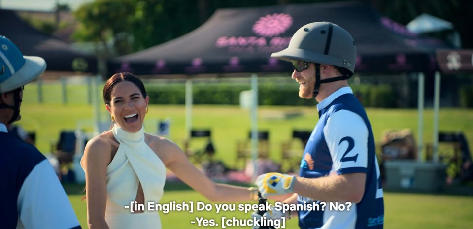 Meghan and Harry laughing at a polo match.