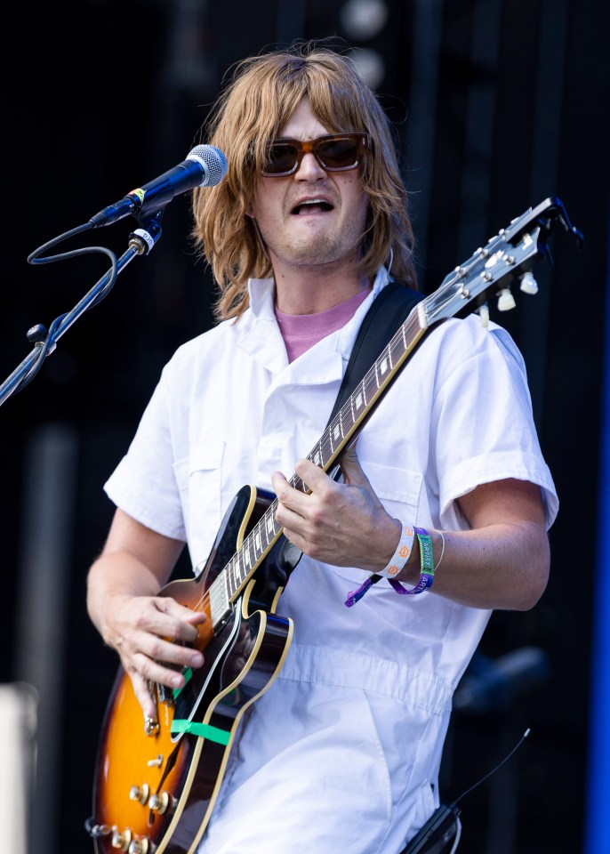 Joe Keery performing at a music festival.