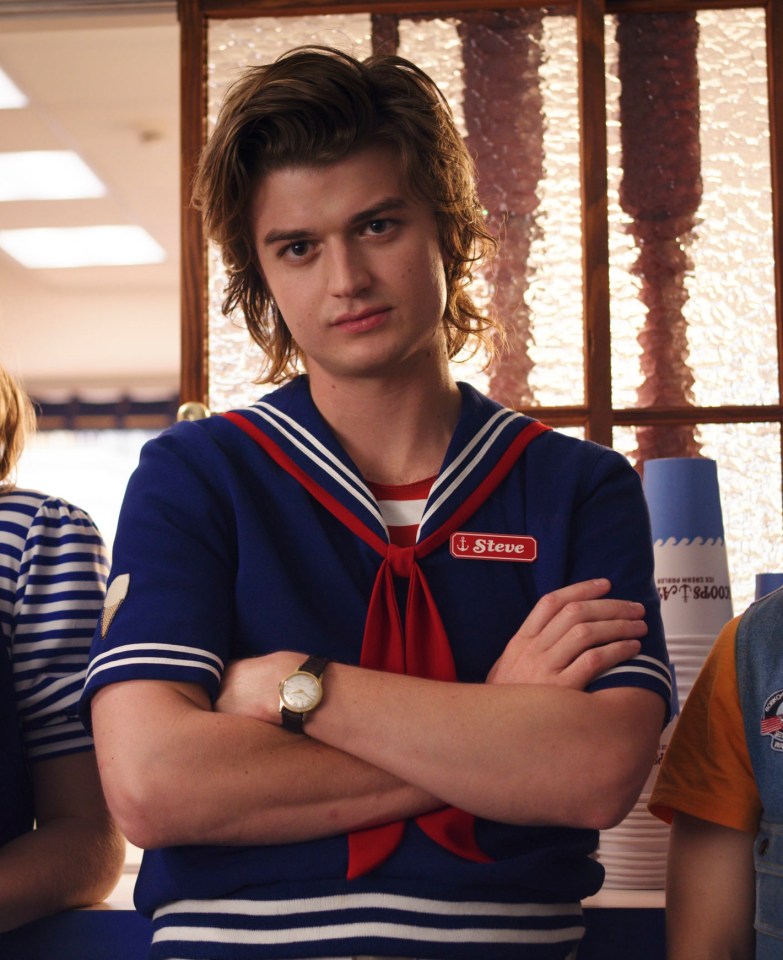 Steve Harrington from Stranger Things in a Scoops Ahoy uniform.