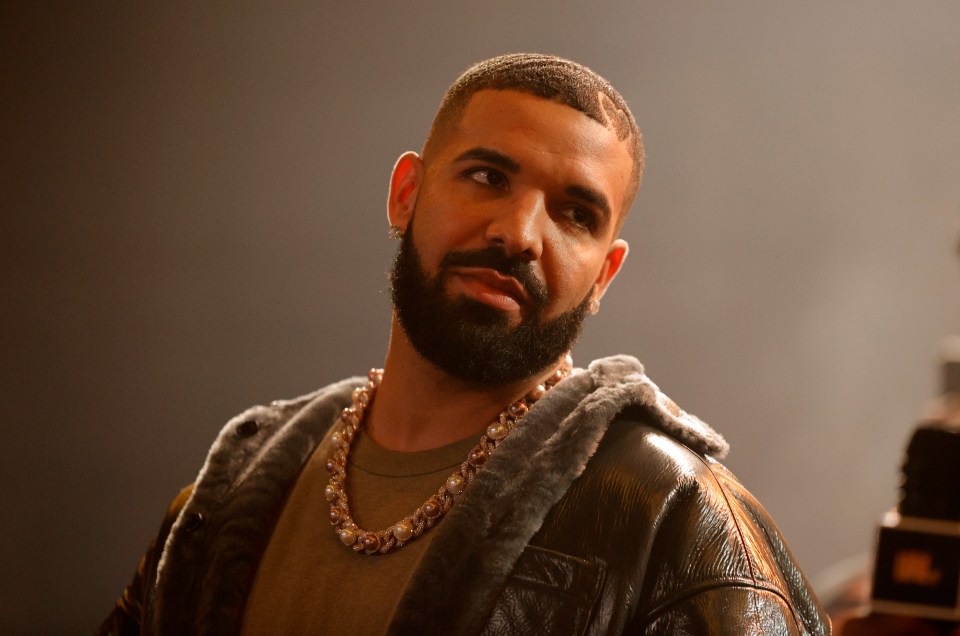 Drake onstage at a rap battle.