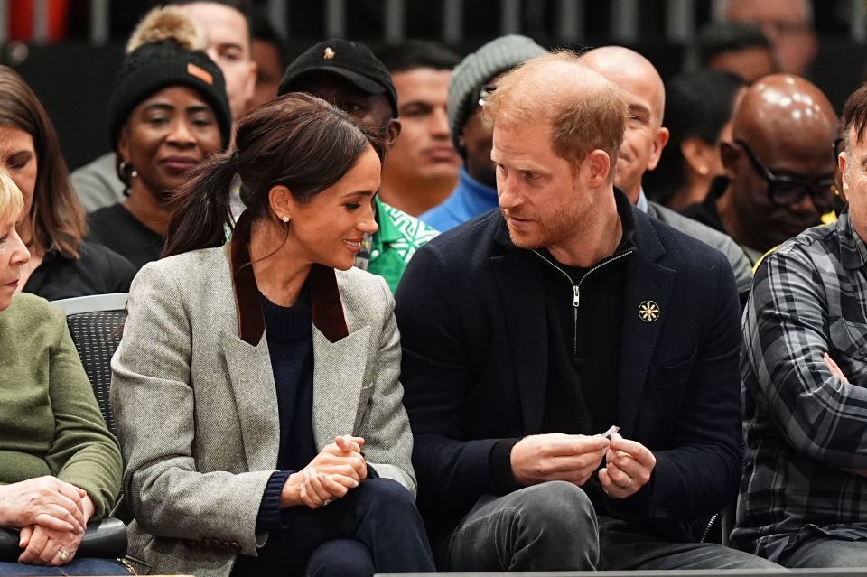 The Duke and Duchess of Sussex at a wheelchair basketball game.