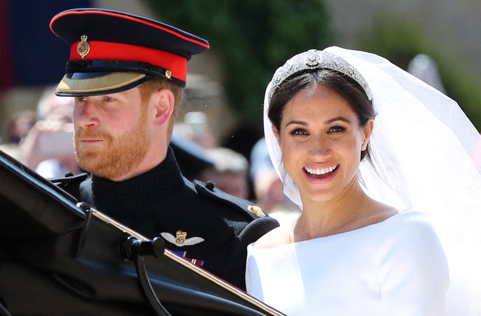 Prince Harry and Meghan Markle in a carriage procession on their wedding day.