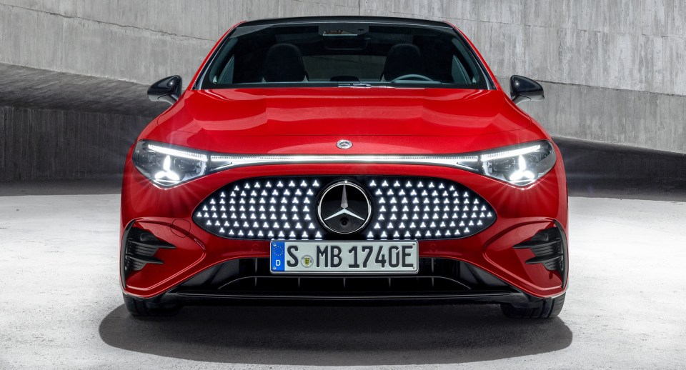 Red Mercedes-Benz CLA-Class parked in a concrete garage.
