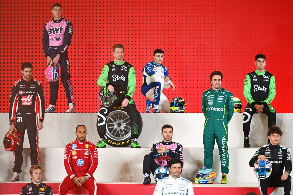 Group photo of Formula 1 drivers at a photocall.