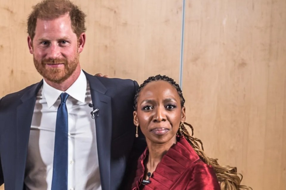 Group photo of Prince Harry and four other people at a panel discussion.