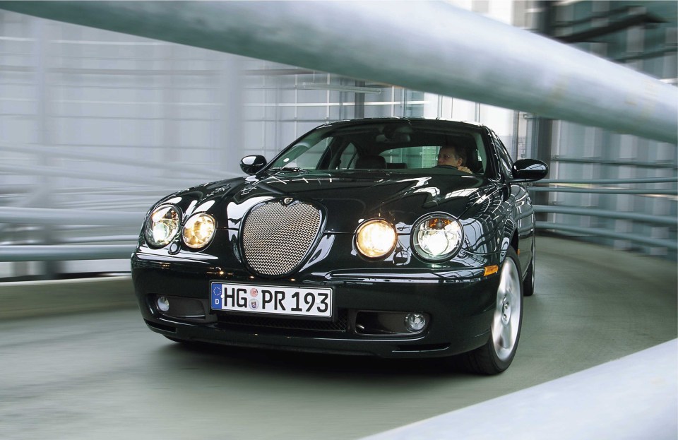 Black Jaguar S-Type R driving.