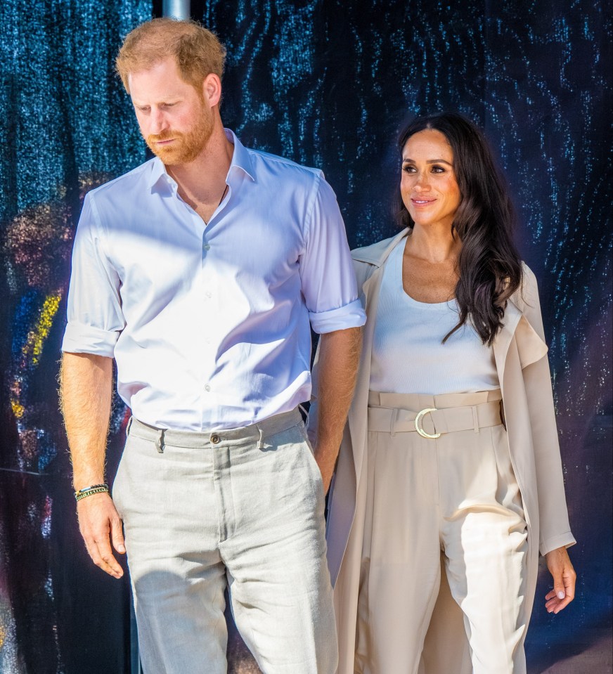 Prince Harry and Meghan Markle walking together.