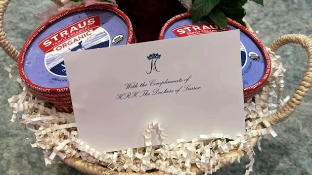 Gift basket with ice cream, jam, mint, and a note from the Duchess of Sussex.