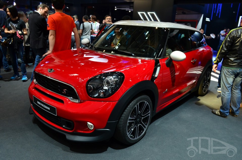 Red Mini Paceman at a car exhibition.
