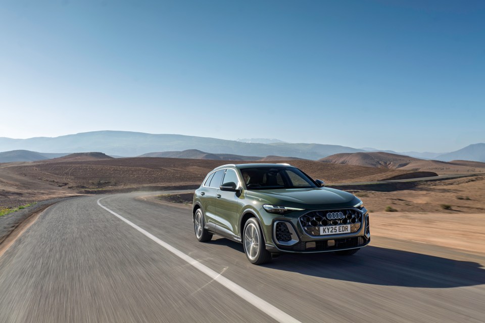 Audi Q4 Sportback driving on a desert road.