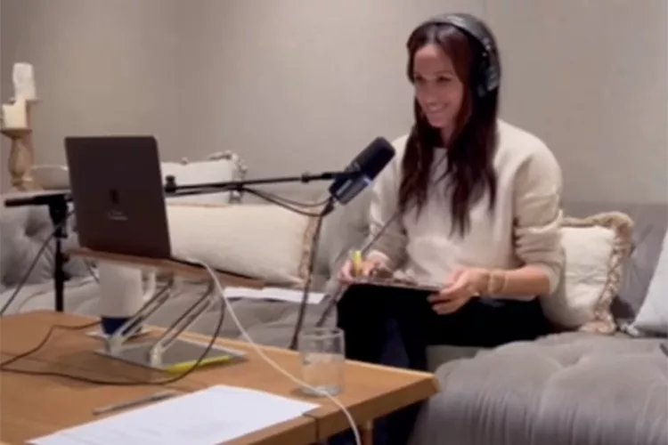 Meghan Markle recording a podcast.