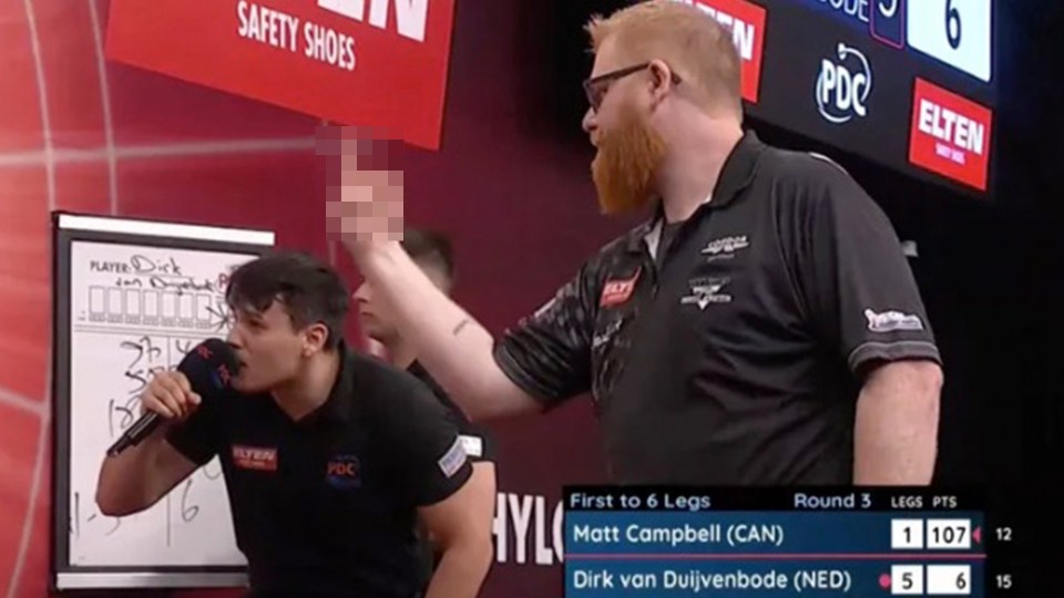 Darts players Matt Campbell and Dirk van Duijvenbode during a match.