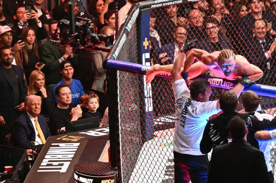 US President Donald Trump with Elon Musk and his son X Ã† A-12 watch as English fighter Paddy Pimblett celebrates winning the lightweight fight against US fighter Michael Chandler (off frame)during UFC 314 at the Kaseya Center in Miami, Florida, in the early hours of April 13, 2025. (Photo by Mandel NGAN / AFP) (Photo by MANDEL NGAN/AFP via Getty Images)