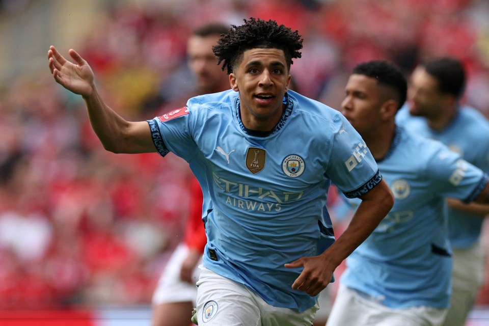 Manchester City's English defender #82 Rico Lewis celebrates scoring the opening goal during the English FA Cup semi-final football match between Nottingham Forest and Manchester City at Wembley Stadium in north London on April 27, 2025. (Photo by Adrian Dennis / AFP) / NOT FOR MARKETING OR ADVERTISING USE / RESTRICTED TO EDITORIAL USE (Photo by ADRIAN DENNIS/AFP via Getty Images)