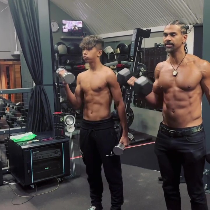 Cassius and David Haye weightlifting in a gym.