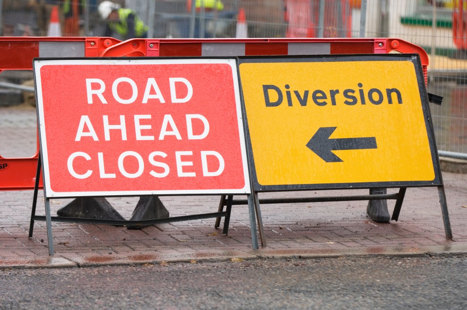Road closed and diversion signs.