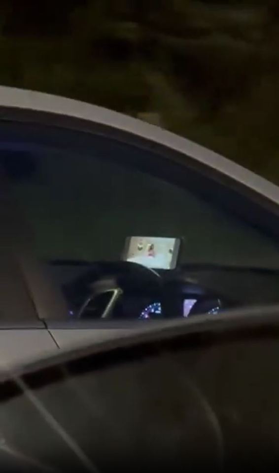 Smartphone mounted on a car's dashboard.