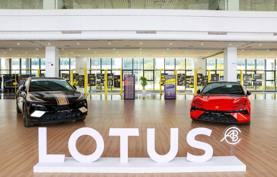 Two Lotus electric vehicles in a showroom.