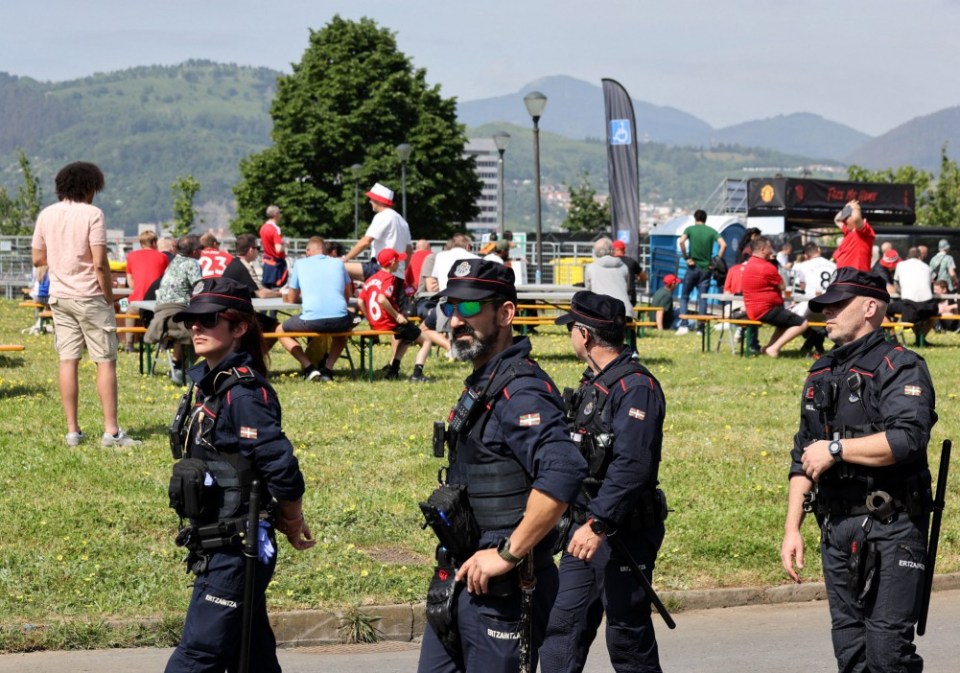 Soccer Football - Europa League - Final - Tottenham Hotspur v Manchester United - Fans gather in Bilbao - Bilbao, Spain - May 21, 2025 Members of the Basque Regional Police Force are seen as fans gather in Bilbao ahead of the final REUTERS/Pankra Nieto