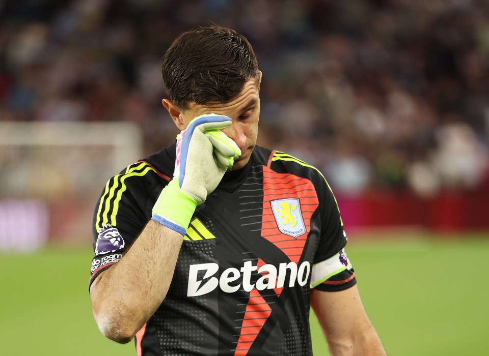 Emiliano Martinez of Aston Villa looking emotional after a victory.