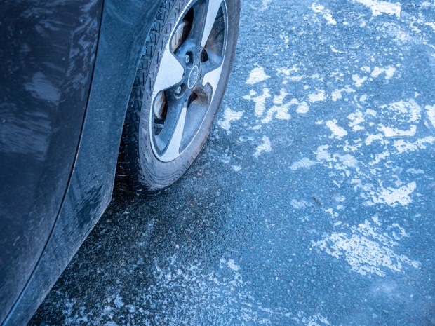 Car tire on icy road.