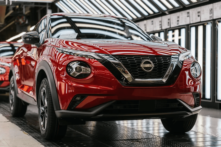Red Nissan Kicks on an assembly line.
