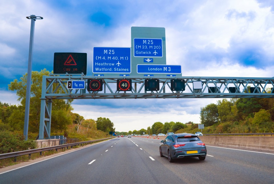 Motorway signs for Heathrow and Gatwick airports near London.