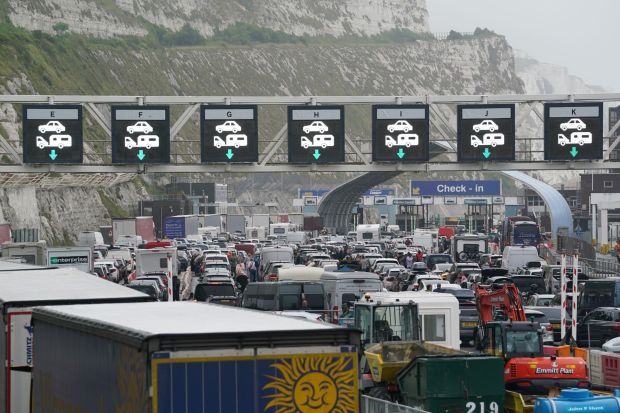 An image collage containing 1 images, Image 1 shows Traffic jam at a border crossing