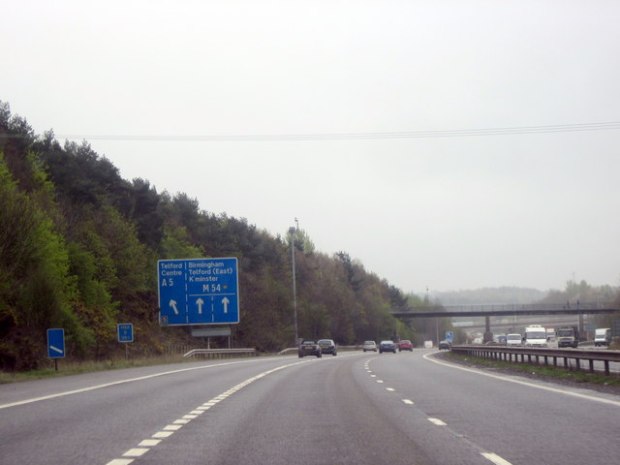 Motorway road sign indicating Telford, Birmingham, and Shrewsbury.