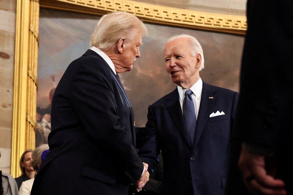 Donald Trump and Joe Biden shaking hands.