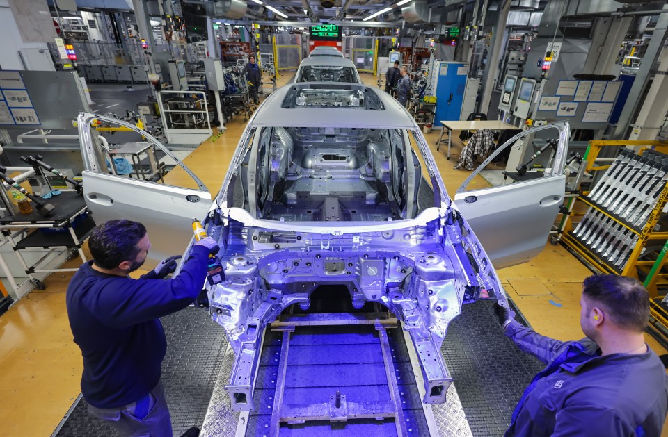 Volkswagen car assembly line workers.